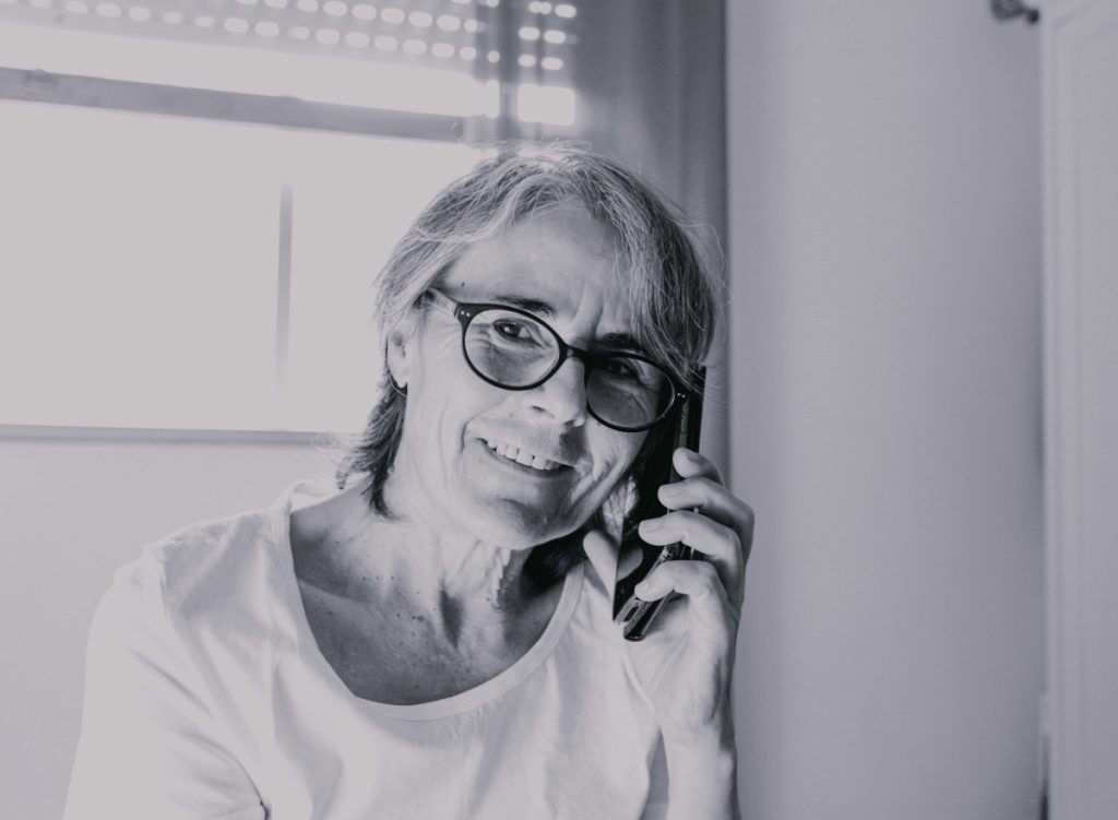 Older person speaking on the phone to request home support
